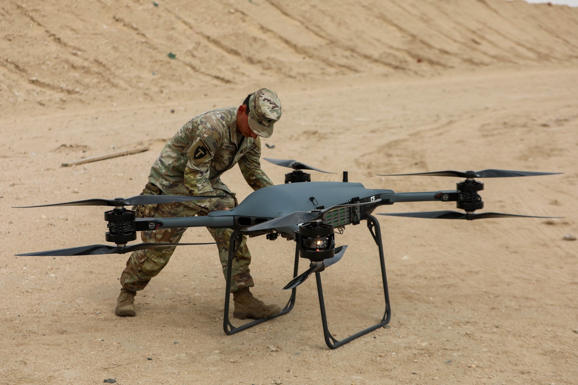 Inserting a battery into Tactical Resupply Vehicle-150. Photo: U.S. Army, Sgt. Alison Strout