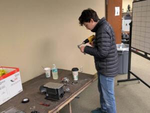 After 3D printing the part using the UTAC Rapid Prototyping Shop, the engineer prepares the new custom adapter plate for use.